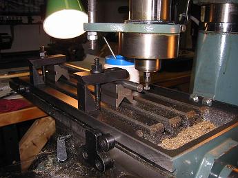  17-Nov-02  Milling a keyway slot in the spur shaft.  The shaft is 12.50 inches long, and the table is cranked 